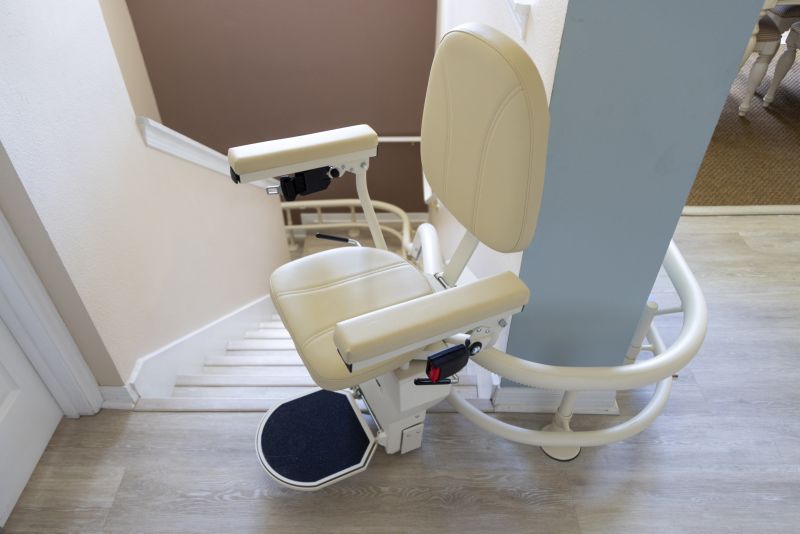 Curved stairlift installed on staircase for improved accessibility